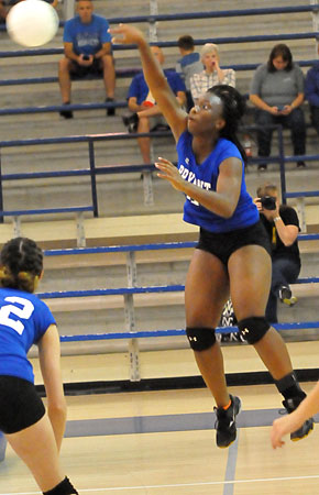 Ivory Russ sends a hit toward the Cabot Red side. (Photo by Kevin Nagle)