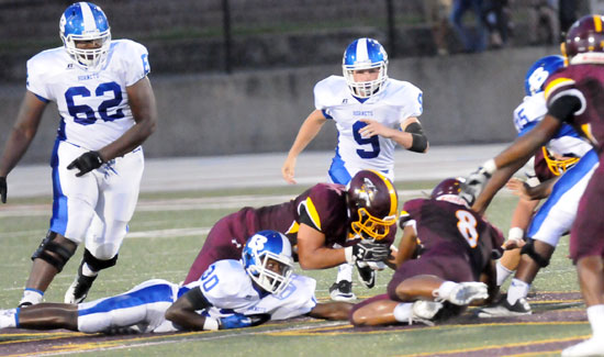 Bryant's Jace Houston (62) and Beaux Bonvillain (9) look to help Jeremiah Long (30) recover a fumble that Lake Hamilton wound up with. (Photo by Kevin Nagle)