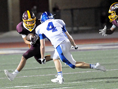 Collin Welch (4) tracks Lake Hamilton's wingback Jacob Nichols. (Photo by Kevin Nagle)