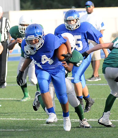 Fabian Torres (44) tries to break through a tackle. (Photo by Kevin Nagle)