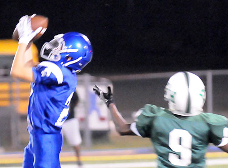 Austin Schroeder intercepts a pass intended for Jeremiah Davis (9). (Photo by Kevin Nagle)
