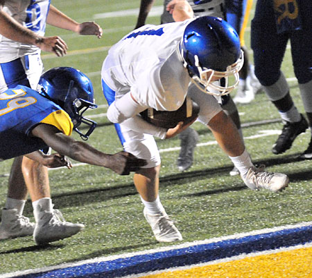 Jake Meaders lunges into the end zone. (Photo by Kevin Nagle)