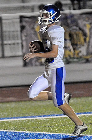 Gage Stark steps into the end zone to complete a 36-yard touchdown pass play just before the half. (Photo by Kevin Nagle)