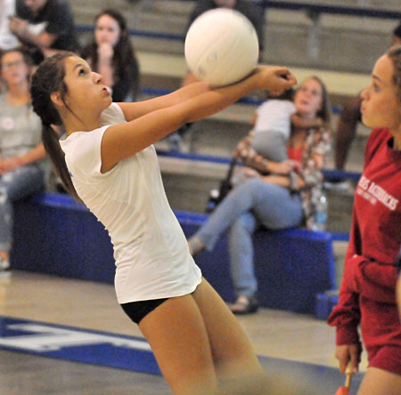 Olivia German makes an over the shoulder pass at the end line during Monday's match. (Photo by Kevin Nagle)