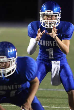 Quarterback Jake Meaders sets to take a snap. (Photo by Rick Nation)