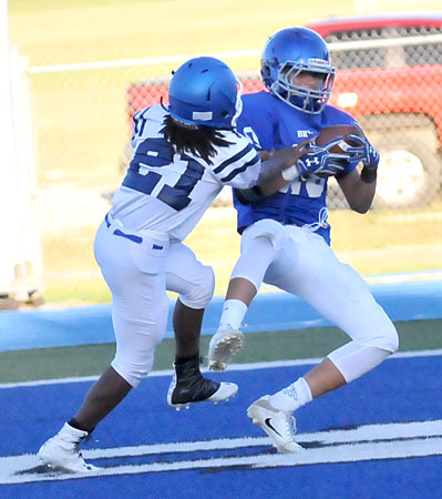 Austin Ledbetter (10) hauls in a touchdown pass despite the efforts of Conway Blue's Donovan Nooner. (Photo by Kevin Nagle)