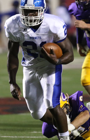 Cameron Coleman barrels past a tackler. (Photo by Rick Nation)