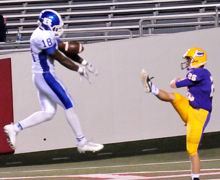 Marvin Moody blocks the punt of Catholic's Carlton Adams. (Photo by Kevin Nagle)