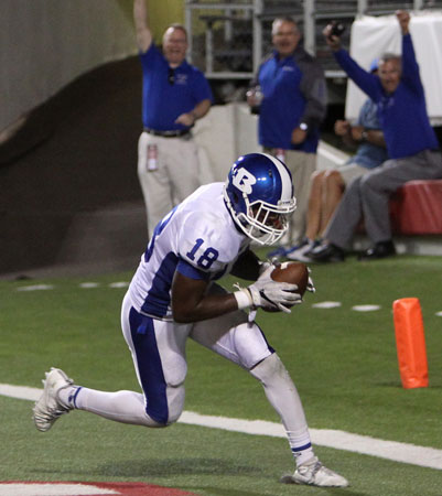 Marvin Moody recovers the kick he blocked for a touchdown. (Photo by Rick Nation)