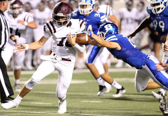 Bryant's Mike Jones strips the ball away from Benton's Nate Beck, causing a fumble that Jones recovered. (Photo by Rick Nation)