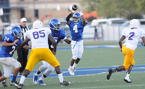 Connor Coleman (4) grabs a swing pass as teammates Carlos Albarran (74) and Myles Aldrige (5) try to clear some running room. (Photo by Kevin Nagle)