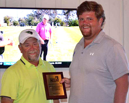 Bryant High School alum Austin Harmon, right, is awarded the individual medalist trophy at the NCCAA Central Regional Golf Tournament. (Photo courtesy of Darryl McPhate, CBC)
