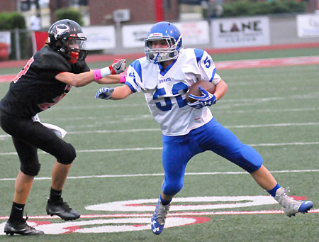 Bethel linebacker Brayden Godwin, evades a tackler as he heads up the field after taking the ball away from a Russellville runner. (Photo by Kevin Nagle)