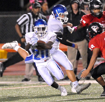 Trevon Herron (20) returns an interception right before the half. (Photo by Kevin Nagle)