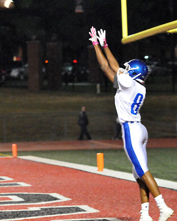 Catrell Wallace leaps to haul in a pass for a two-point conversion. (Photo by Kevin Nagle)