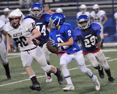 Trey Williams sprints upfield after blocks by Carlos Albarran (74) and Arthur Woods (29). (Photo by Kevin Nagle)