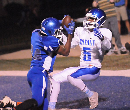 Christian Cain (5) prepares to swipe the ball away from Conway White's Jvonte Reed for an interceptions. (Photo by Kevin Nagle)