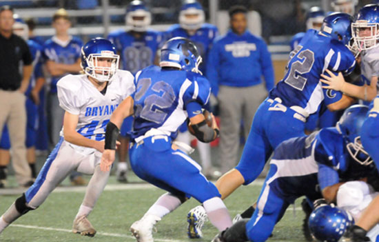 Tristan Sehika (43) closes in on Conway White running back Luke Bailey. (Photo by Kevin Nagle)