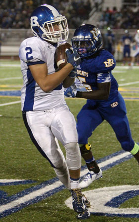 Landon Smith grabs a pass in front of North Little Rock's Lamarcus Fresh (5). (Photo by Rick Nation)
