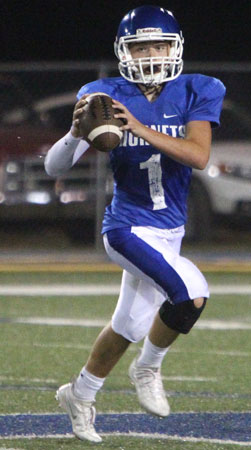 Bryant quarterback Jake Meaders rolls out to pass. (Photo by Rick Nation)