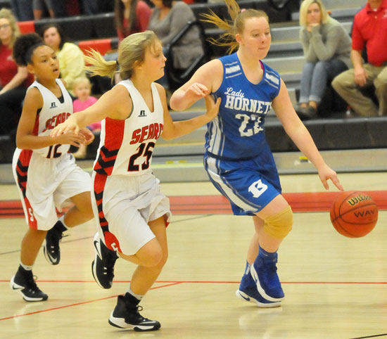 Nicole Ball (22) breaks a Searcy double-team. (Photo by Kevin Nagle)