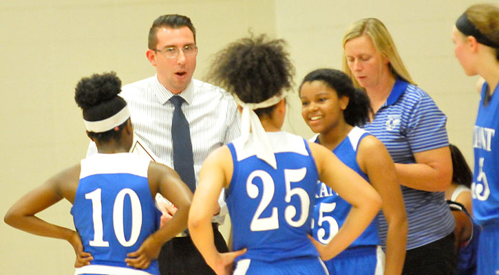 Head coach Nathan Castaldi and assistant DeAnna Ward talk strategy during a timeout. (Photo by Kevin Nagle)