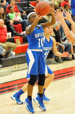 Tierra Trotter fired a 3 as teammate Lexi Taylor looks to get into position for a rebound. (Photo by Kevin Nagle)