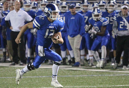 Quarterback Ren Hefley turns the corner on the way to the end zone. (Photo by Rick Nation)