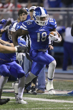 Marvin Moody heads up the sideline after an interception, picking up a block by Collin Welch (4) on his way to the end zone. (Photo by Rick Nation)