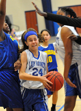 Bethel's Rachel Cicero tries to work through physical play inside to get to the basket. (Photo by Kevin Nagle)