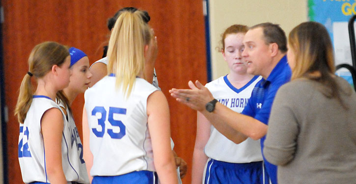 Bethel coach Derek McGrew instructs the Lady Hornets during a timeout. (Photo by Kevin Nagle)