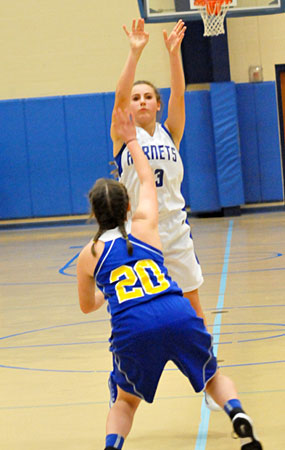 Baylee Hutchison fires a jumper from near the top of the key. (Photo by Kevin Nagle)
