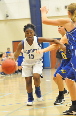 Rachel Eggerson works the ball up the floor. (Photo by Kevin Nagle)