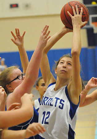 Maddie Grice goes up for a shot in traffic. (Photo by Kevin Nagle)