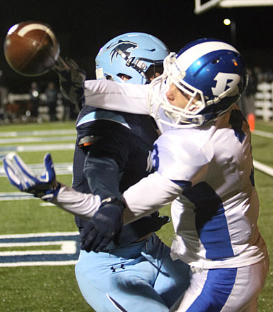 Reece Coates reaches back through a Har-Ber defender to make a circus catch. (Photo by Rick Nation)