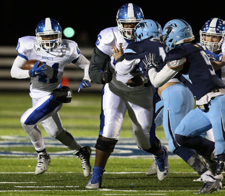 LaTavion Scott follows the block of Jace Houston (56). (Photo by Rick Nation) 