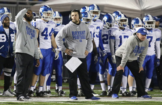 Bryant's defensive coaches, from left, Darrell Burnett, Travis Queck and Brad Stroud. (Photo by Rick Nation)