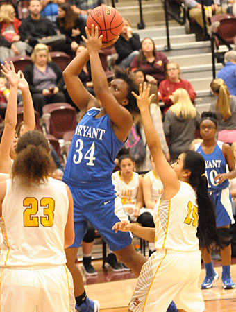 Bryant's Ivory Russ attacks the basket. (Photo by Kevin Nagle)