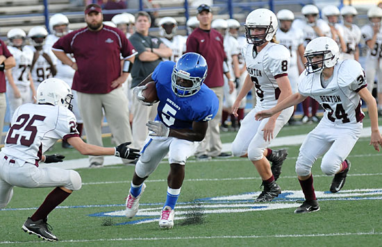 Myles Aldrige (5) tries to maneuver through Benton's Cade Smith (25) and Tristan Hawkins (8). (Photo by Kevin Nagle)