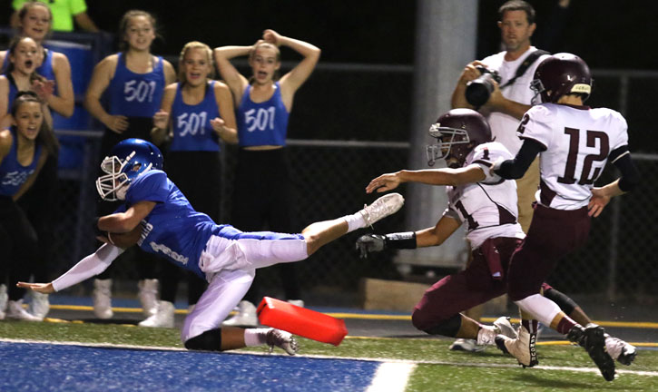 Jake Meaders dives into the end zone at the end of his 39-yard run. (Photo by Rick Nation)