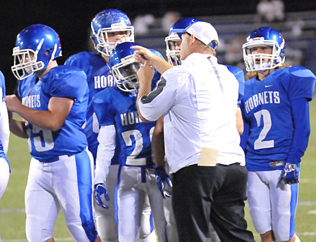 Bryant defensive coach John Orr instructs during a timeout on Tuesday. (Photo by Kevin Nagle)