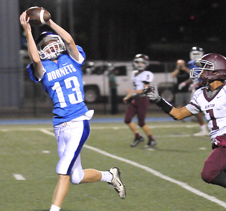 Gage Stark reaches up to haul in a touchdown pass. (Photo by Kevin Nagle)