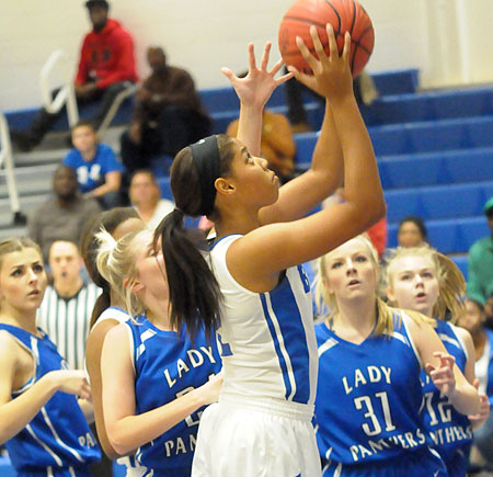 Raven Loveless goes up for a shot in traffic. (Photo by Kevin Nagle)