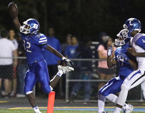 Antonio Todd reaches the end zone at the end of his interception return as teammate Andrew Hayes trails the play. (Photo by Rick Nation)