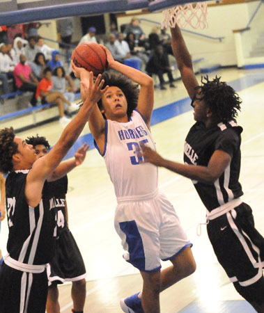 Ethan Hilkert goes up for a shot in traffic. (Photo by Kevin Nagle)