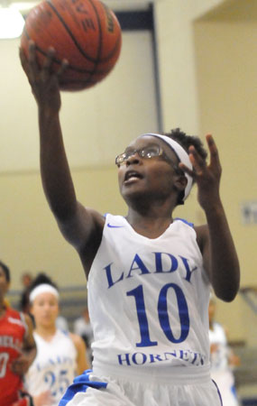 Tierra Trotter converts a layup after one of several steals Monday night. (Photo by Kevin Nagle)